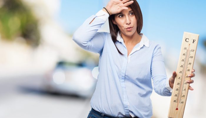cool young woman with thermometer
